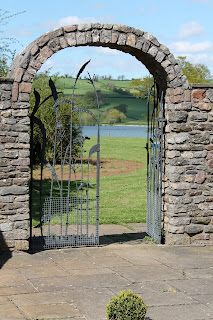 Stone arch, gate and lake