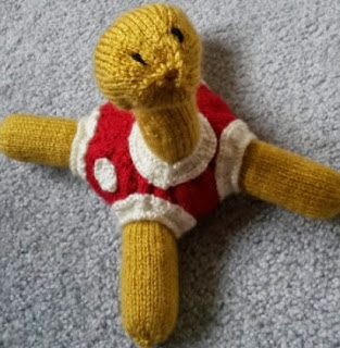 http://es.scribd.com/doc/251504829/Knitted-Shuckle-Pattern