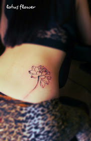A drawing style lotus flower tattoo on the hip