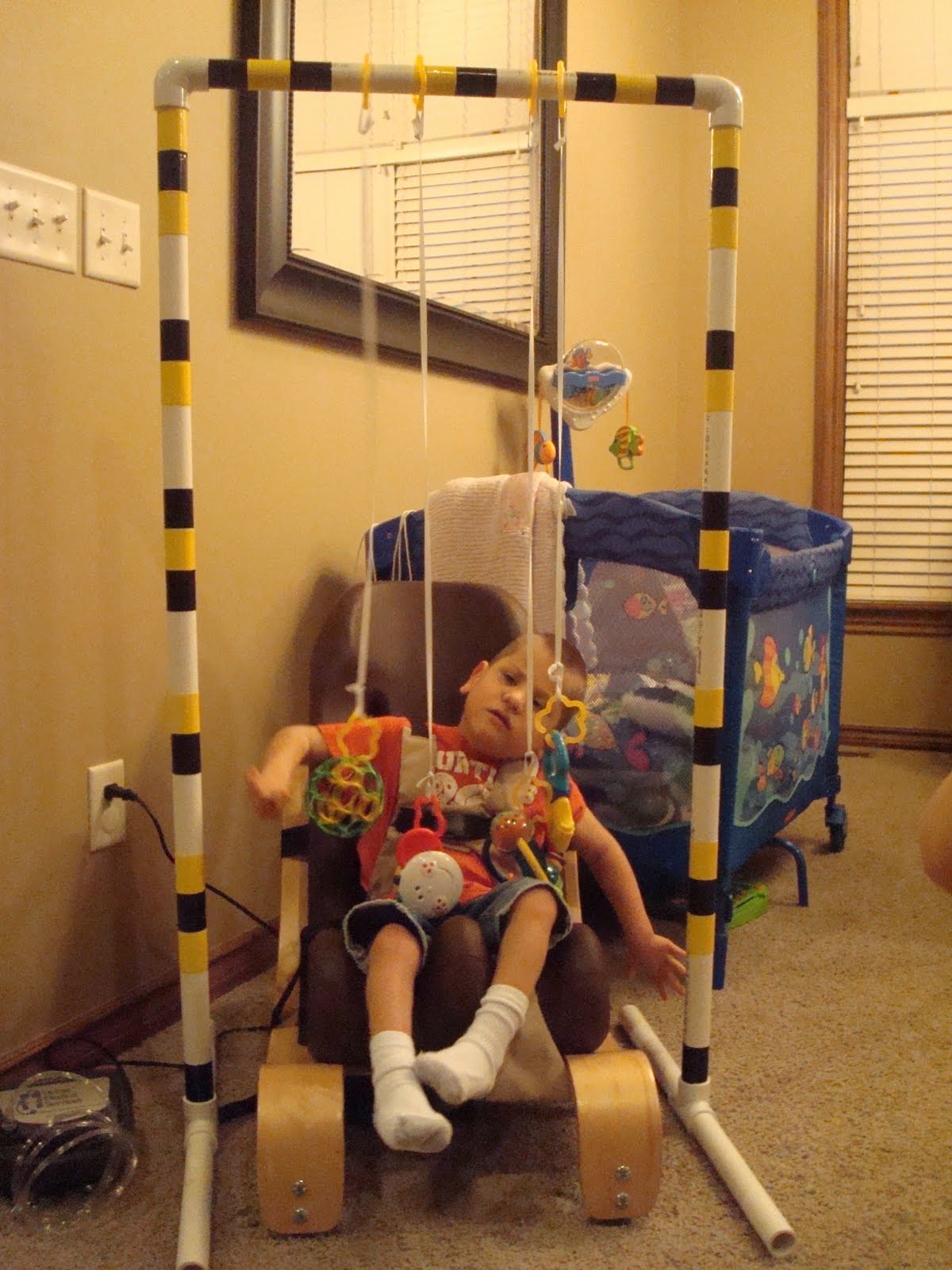 Kinnick Kay and Carver Lee Toy Gym made out of PVC Pipe Very Cool