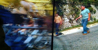The Impressions de France bikers zoom past the camera.