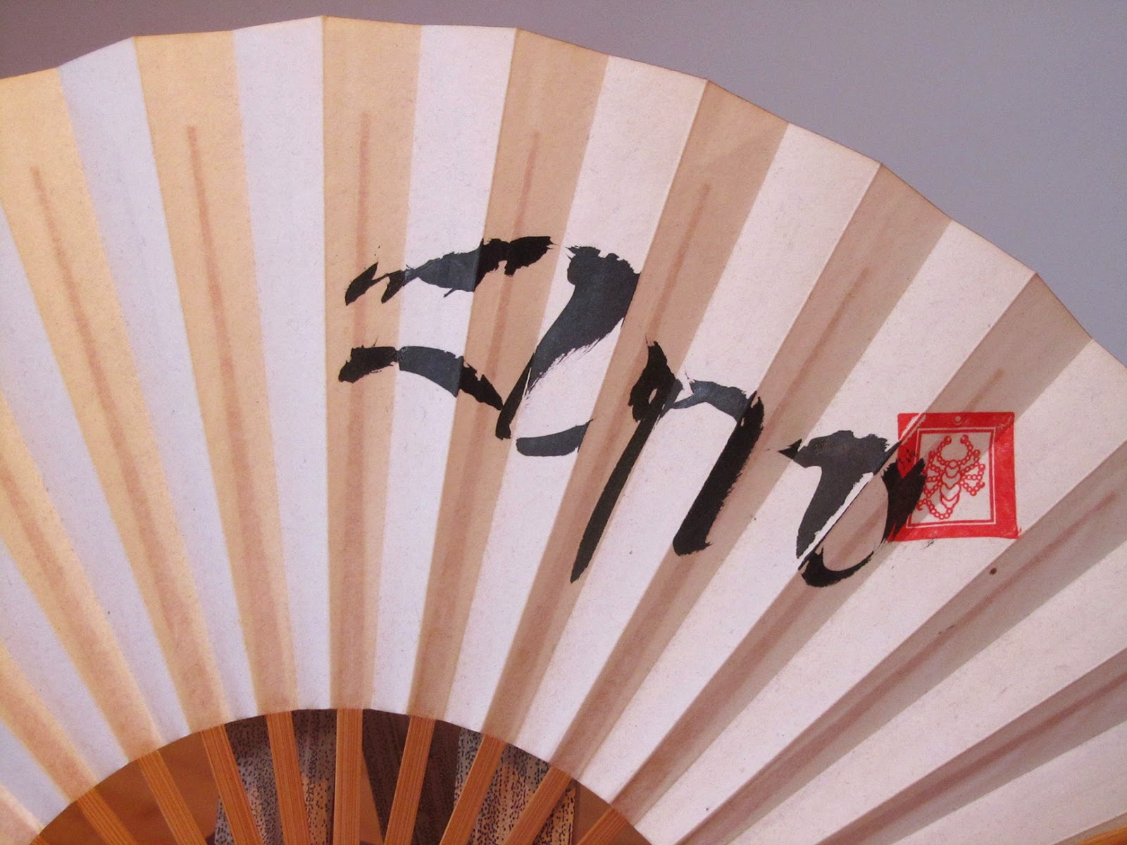 white Shambhala fan with calligraphy and stamp