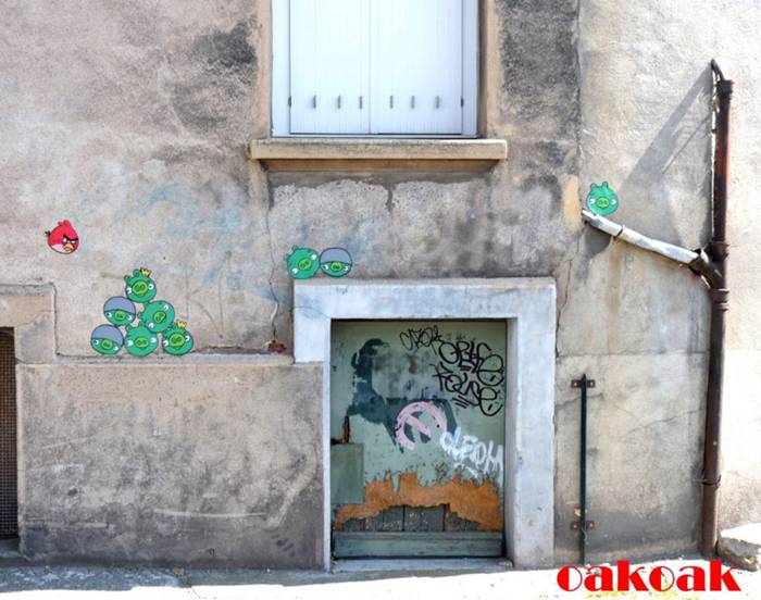 OakOak is a street artist, but he is not a fine artist painting in public. His work, either on the streets of his native St Etienne, France, or made on his travels, is opportunistic and never “authorised”. He is completely untrained in art and works full-time in an office. Whilst his favourite artist is Amedeo Modigliani, he cites his main influences as football, comic books, video games and his home town. “I like this city, her atmosphere” OakOak says of Saint-Étienne “and I wanted it to look nicer. It was an industrial city with many coal mines; now it’s in regeneration and still quite poor. But it’s easily travelled by foot with awkward aspects ideal for art. I saw shapes everywhere, and wanted to realise them.”