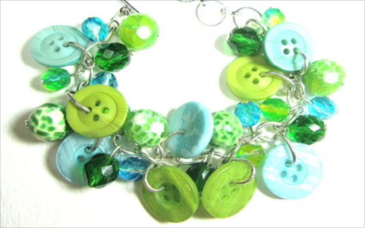Green Big Bling Bracelet Bracelet has green and teal buttons with beads in pretty charm style design