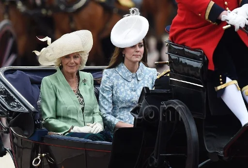 Catherine, Duchess of Cambridge and Camilla, Duchess of Cornwall as they travel in an open state carriage from Buckingham Palace
