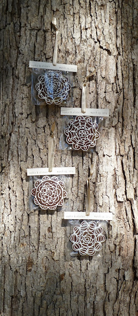 wedding favor tea biscuits hung on white oak bark