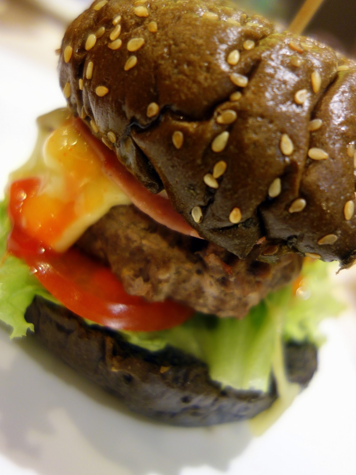 Steamed beef burgers, slightly more moist/wet, are served too, topped