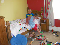 boys and girl playing in bedroom 