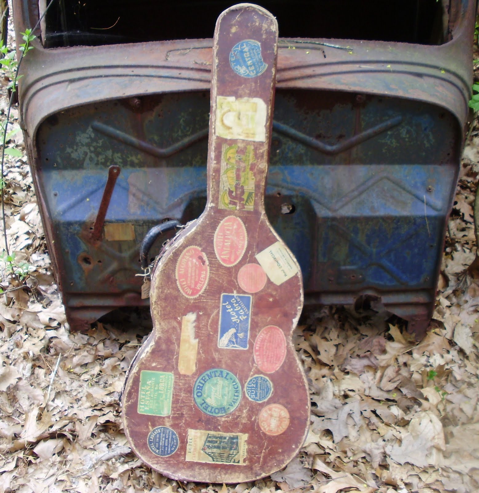 Log Cabin Antiques & Gifts Well traveled guitar case