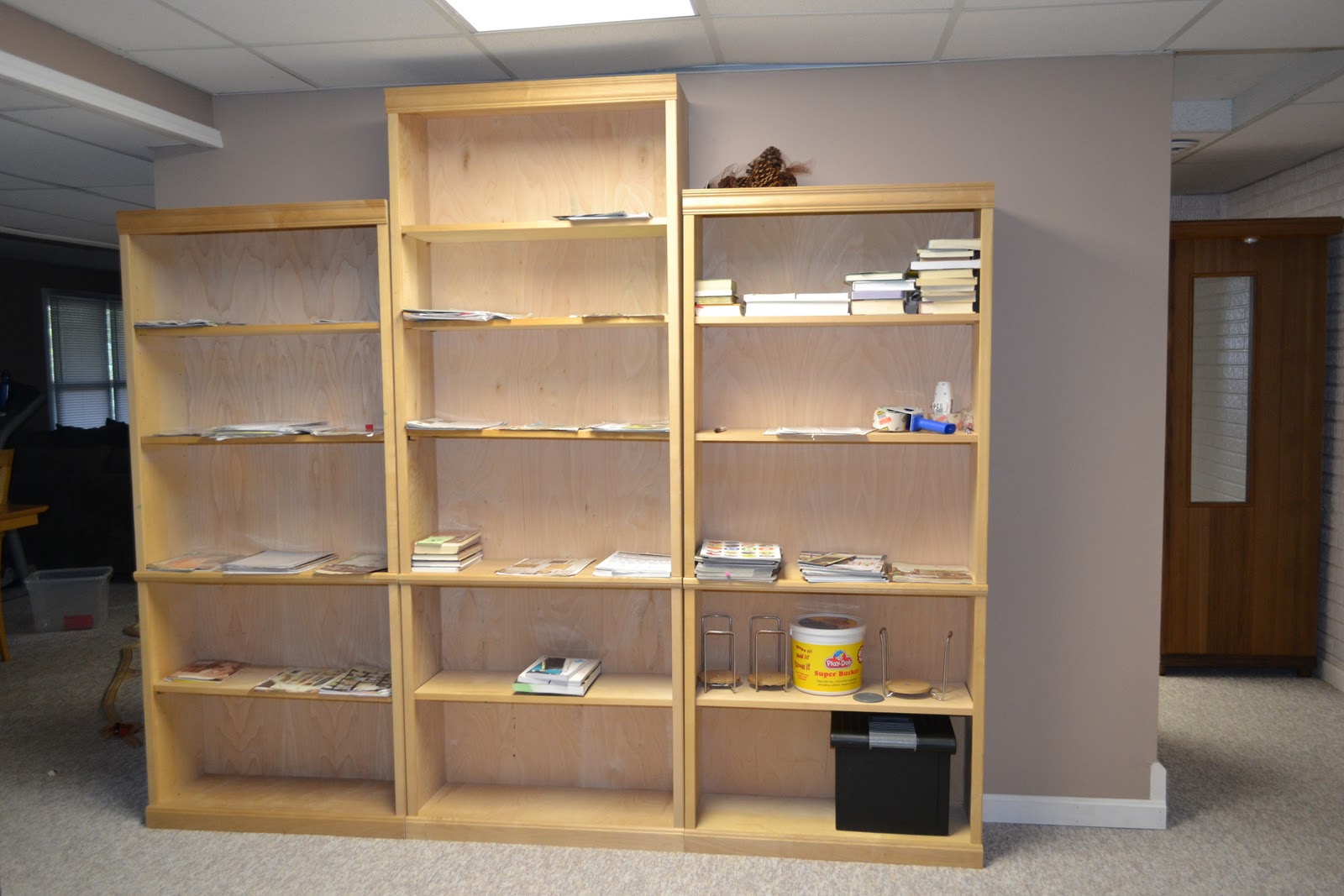 Kitchen cabinet cost estimator and 7 foot unfinished wood bookshelves, currently used to sort