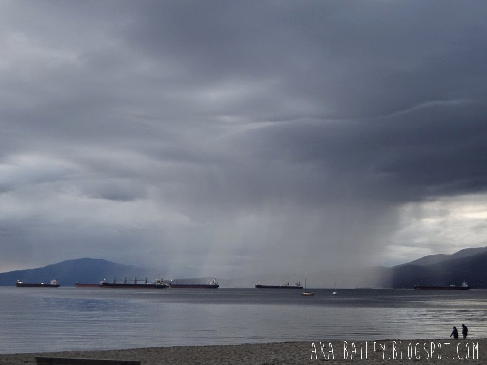 Rain cloud over West Vancouver, raining on the tankers in English Bay