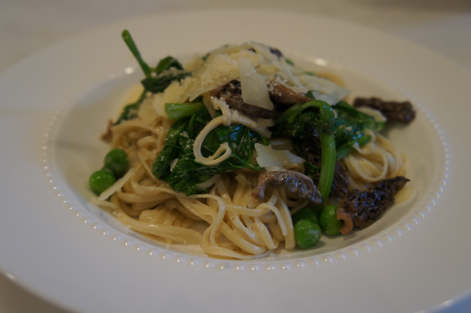 Homemade Pasta with Fresh Morels, English Peas and Pea Vines