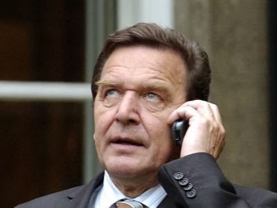 German chancellor Gerhard Schröder using a mobile cell phone