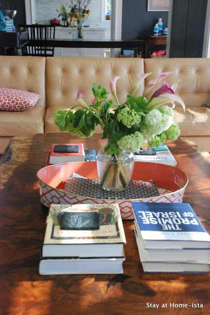 a kid-friendly way to style a living room- stacks of books 