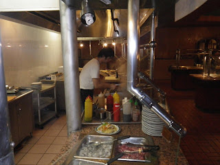 Mongolian barbecue chef preparing my order.