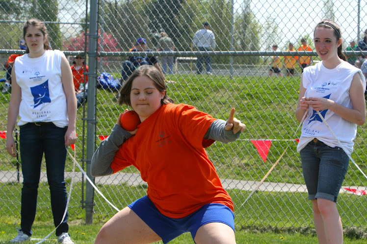 SPECIAL OLYMPICS ATHLETE COMPETES IN THE SHOT PUT