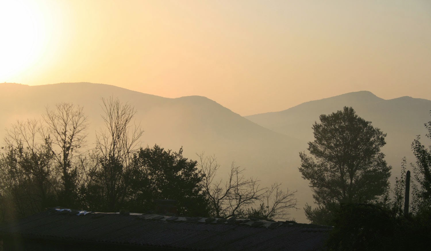 Hazy mountains and the edge of the sun Hazy mountains and the edge of the sun