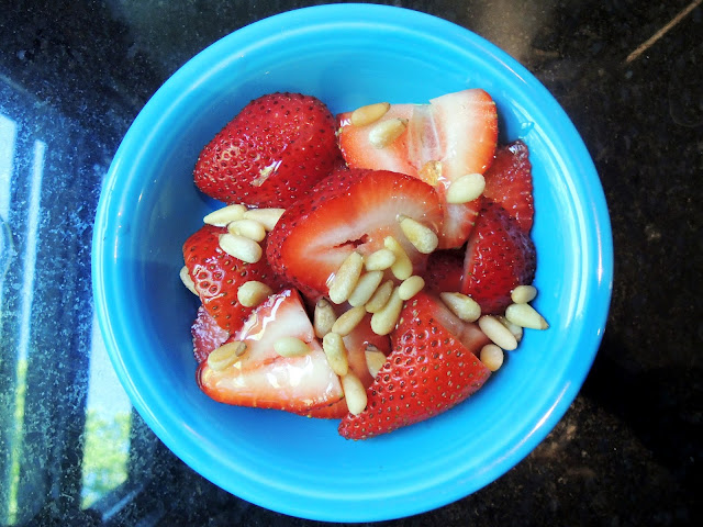 Strawberries with toasted pine nuts and honey