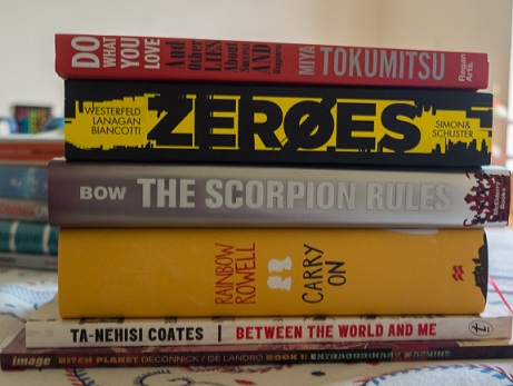 Book pile: Do What You Love, Zeroes, The Scorpion Rules, Carry On, Between the World and Me, Bitch Planet