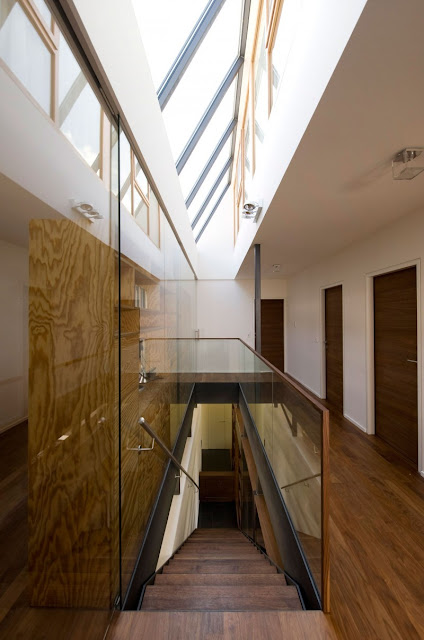 Long Iron Handrail and Wooden Footings under the Bright Skylights