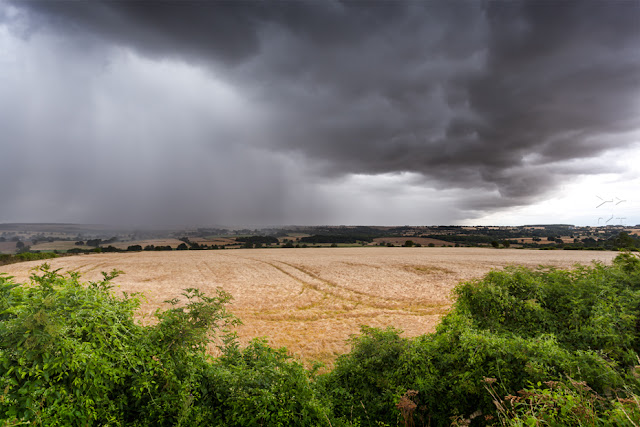 A storm front sweeps across the Cotswold landscape by Martyn Ferry Photography