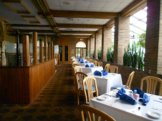 a restaurant with tables and chairs