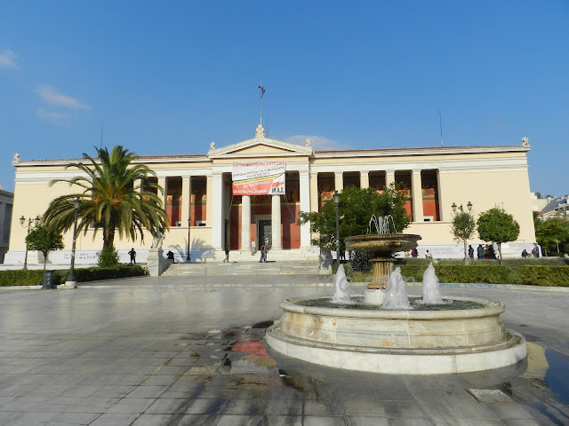 A fountain sits in front of the University of Athens Main Building