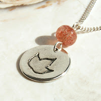 orange sunstone fall leaf charm necklace in fine and sterling silver by Jennifer Kistler