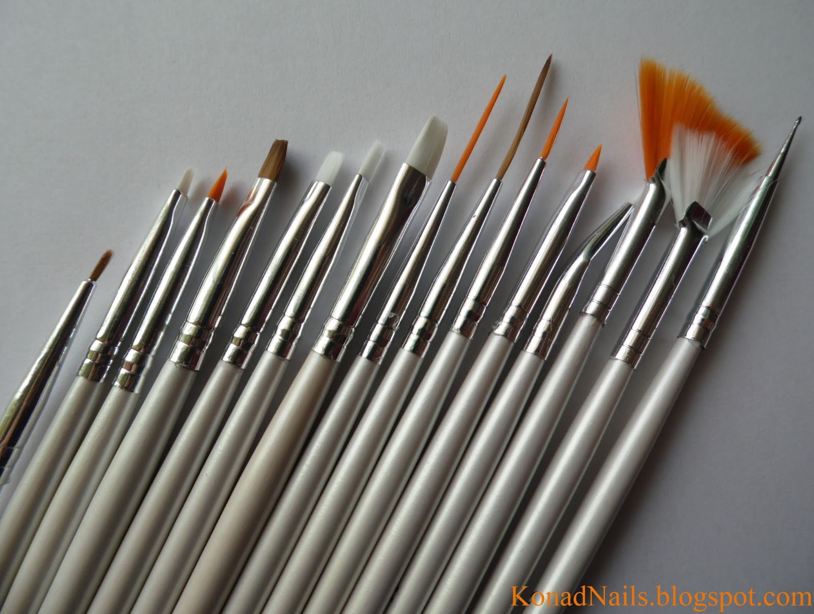 Konad Addict Striped nail art using fan brush