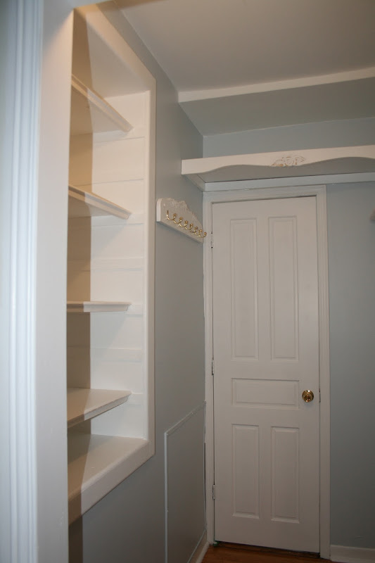 left side of the cupboard. I built a tie rack and shelves for storage title=