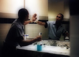 A janitor a toilet mirror. A janitor a toilet mirror.