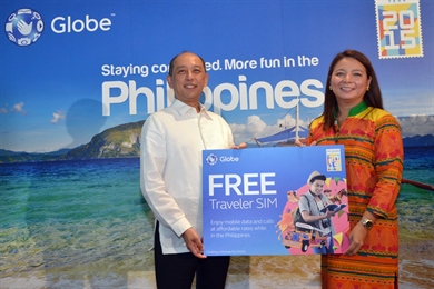 L-R: Launching the partnership between the Tourism Promotions Board (TPB) and the country's number one mobile brand Globe Telecom to further boost Philippine tourism and promote TPB's Visit the Philippines Year 2015 campaign are TPB Chief Operating Officer Ramon Domingo C. Enerio III and Globe Senior Vice President for International Business Rizza Maniego-Eala. Globe is offering its Globe Traveler SIM for free to millions of international tourists and returning OFWs so they can enjoy seamless connectivity with affordable call, text and mobile browsing rates while in the Philippines. Globe Telecom boosts Visit the Philippines Year 2015 campaign
