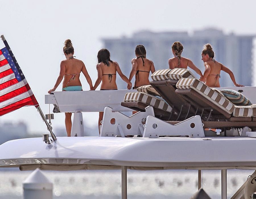 Ashley Tisdale keeps up The Bikini Fun while jumping on a yacht in Miami Ashley Tisdale wasted no time to stripping down with her female friends for yacht vacation on Saturday, May 17, 2014 at Miami, FL, USA.