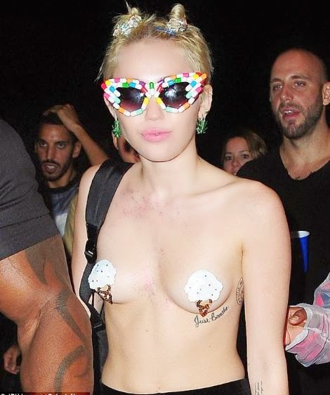 Miley Cyprus steps out without bra; smokes weed in public