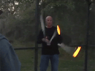 showoff juggler sets fire to onlooker jumper