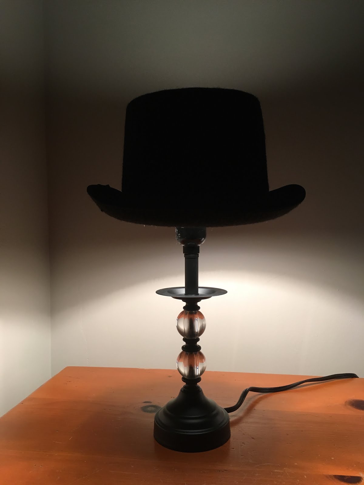 By the Light of the Chandelier Top Hat Lamp