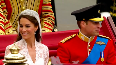 The weds, Catherine smiles happily on the carriage. YouTube 2011.