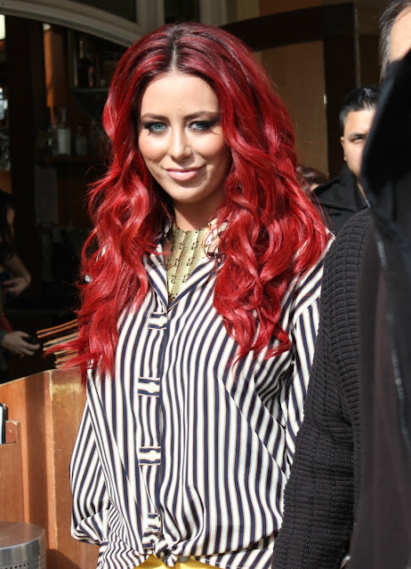 Aubrey O'Day shows off red hair with cast of Celebrity Apprentice