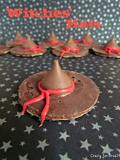 witch hat cookies - chocolate pinwheel cookie upside down with hersheys kiss and red frosting bow