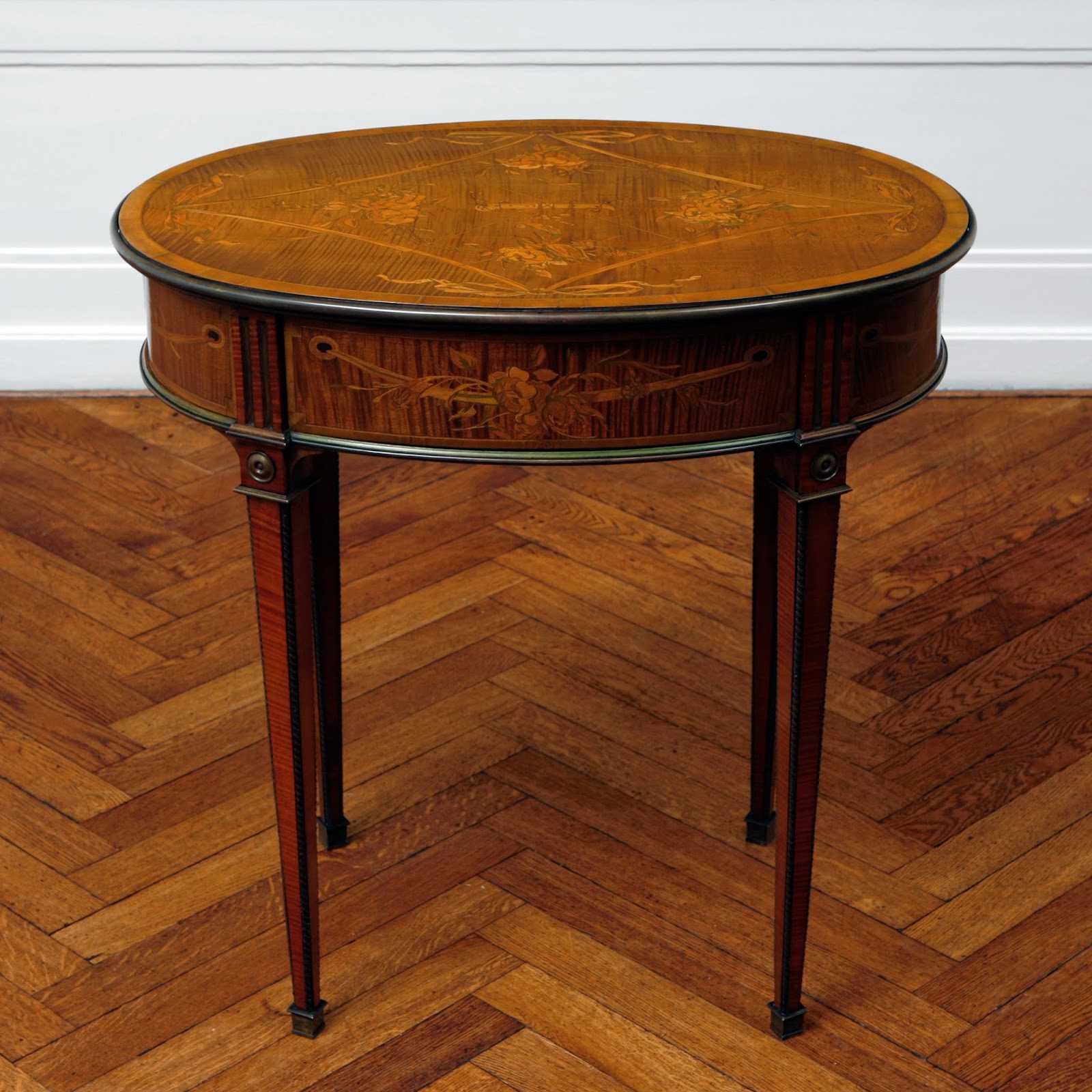 A pair of tables; veneered with maple, with inlays of various woods David Roentgen, Germany, c. 1780