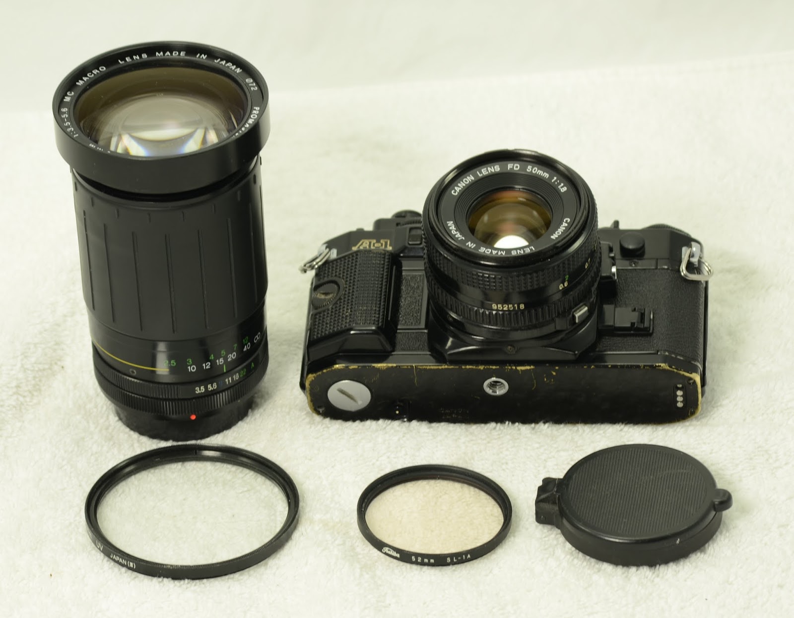 Vintage Camera House Canon A1 kit with 2 lenses