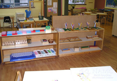 NAMC montessori prepared environment class decor wood shelving