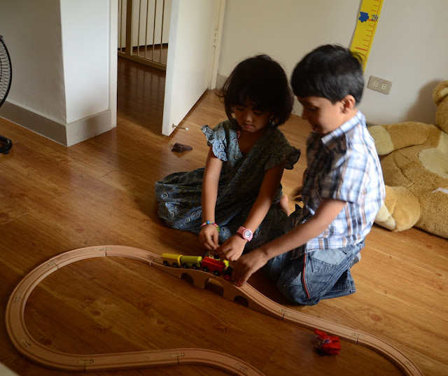Kecil playing with Ikea train set with friend