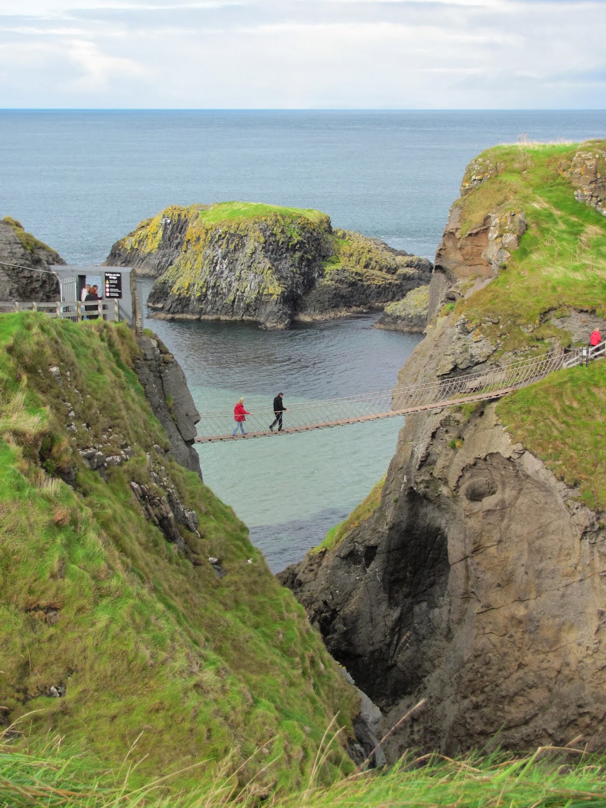View of a Crossing A look at others crossing the Carrick-A-Rede Rope Bridge from a distance Northern Ireland
