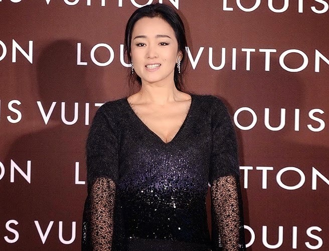 Chinese actress Gong Li poses during the opening ceremony for the