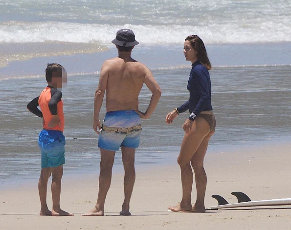 Crown Princess Mary was pictured in the surf with her husband Crown Prince Frederik and their children Prince Christian, Princess Isabella and Princess Josephine.