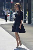 Victoria Beckham black dress and white heels