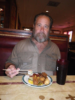 Still wet from the rain but enjoying the meal.