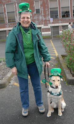 Heidi with yellow Lab in St Patricks Day garb