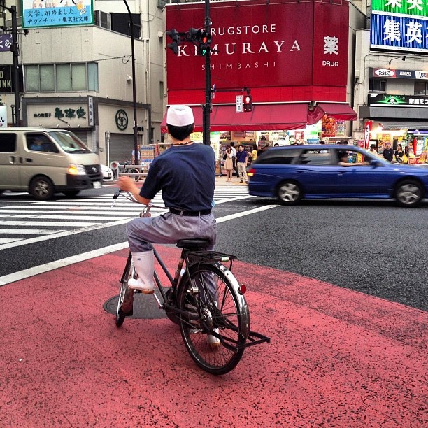 A local restaurant bicycle in a Japanese city. Local bicycle of a restaurant in a Japanese city.